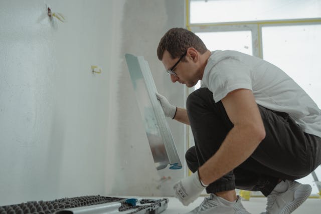 a person making home repairs