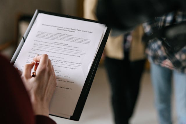 a person signing a lease agreement