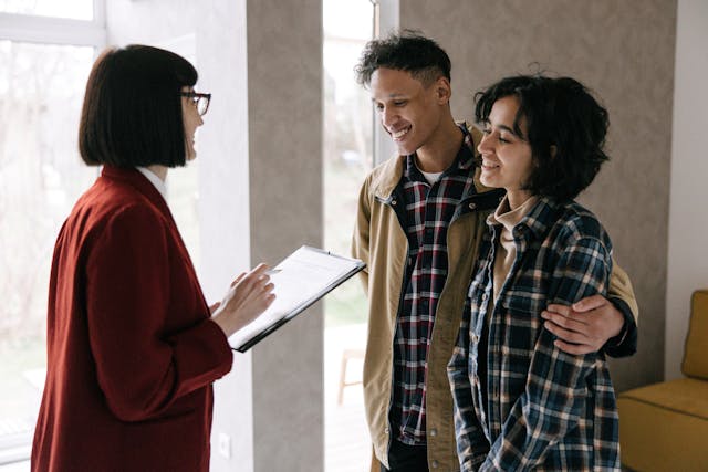 a landlord speaking with two tenants
