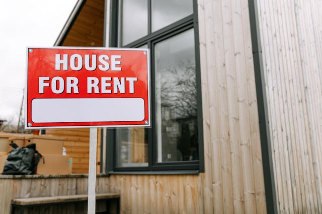 house for rent sign in front of house